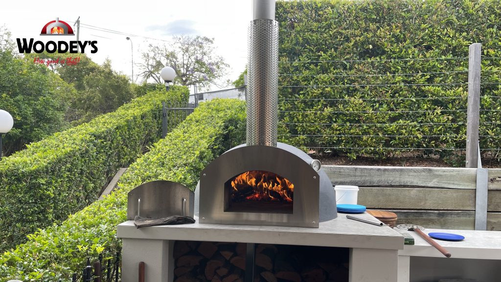 Burning Woodfired Pizza Oven with Stainless Steel Front