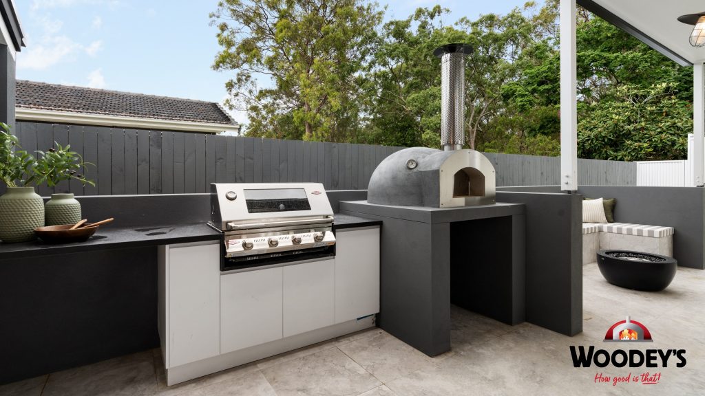 Woodfired Oven with Stainless Steel Front in Outdoor Kitchen